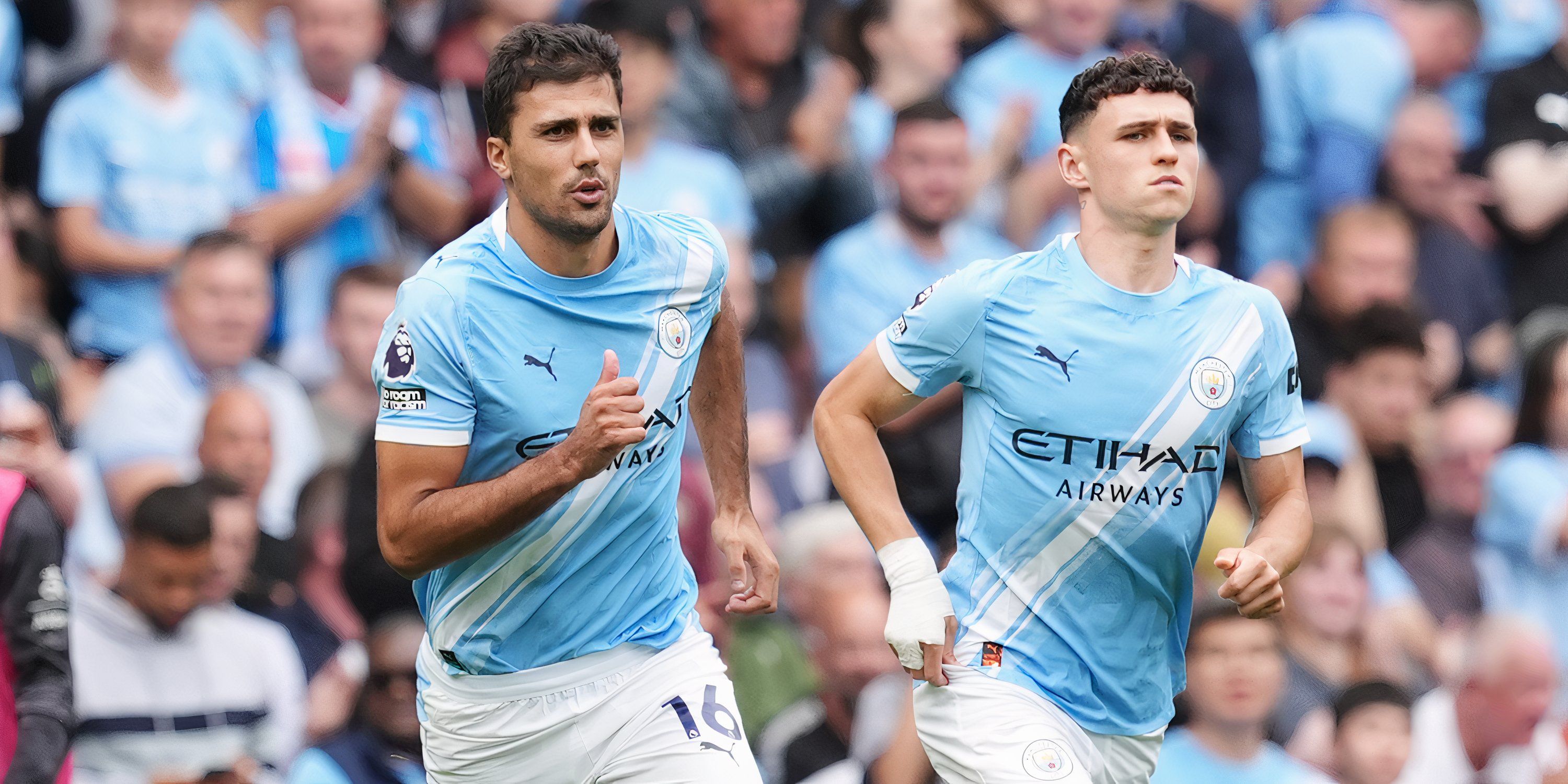 Rodri and Phil Foden in action for Manchester City