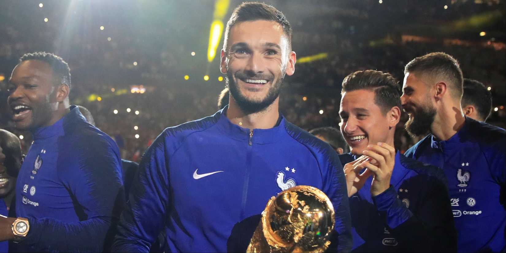 France's Hugo Lloris and team mates celebrate with the World Cup trophy