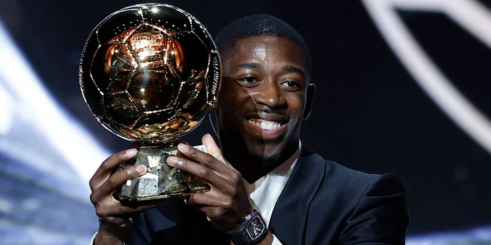 Paris St Germain's Ousmane Dembele celebrates after winning the men's Ballon d'Or award