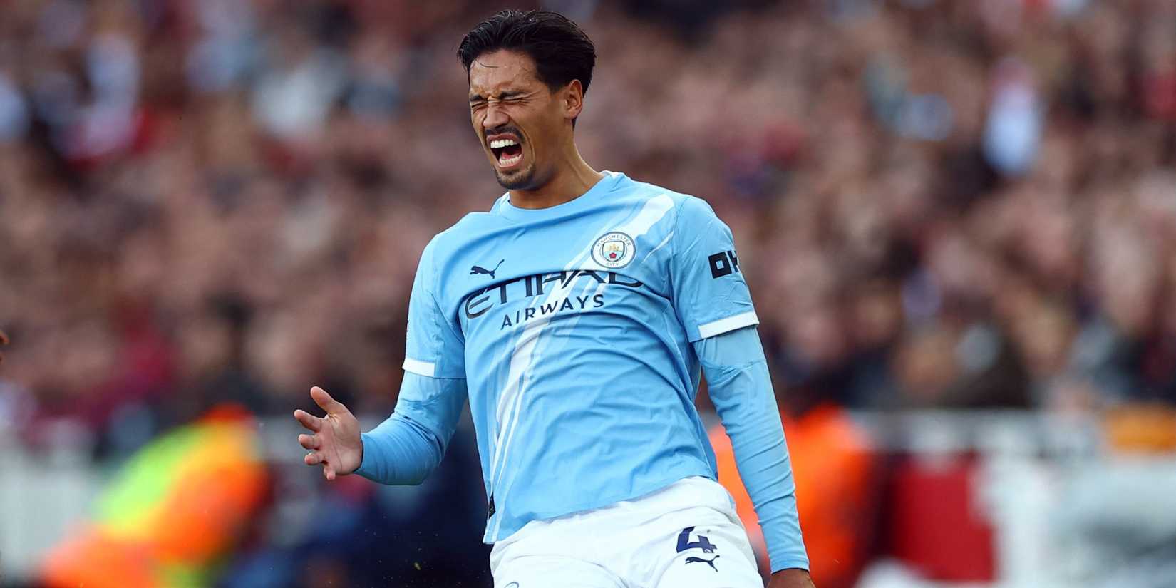 Tijjani Reijnders after getting fouled whilst in action for Manchester City against Arsenal
