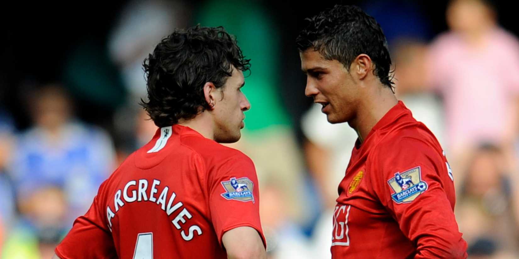 Manchester United's Owen Hargreaves and Cristiano Ronaldo talking to eachother.