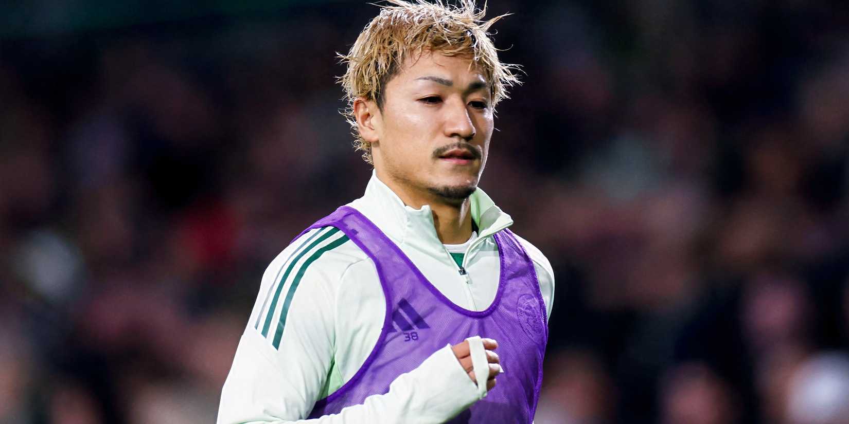 Daizen Maeda warms up in training gear