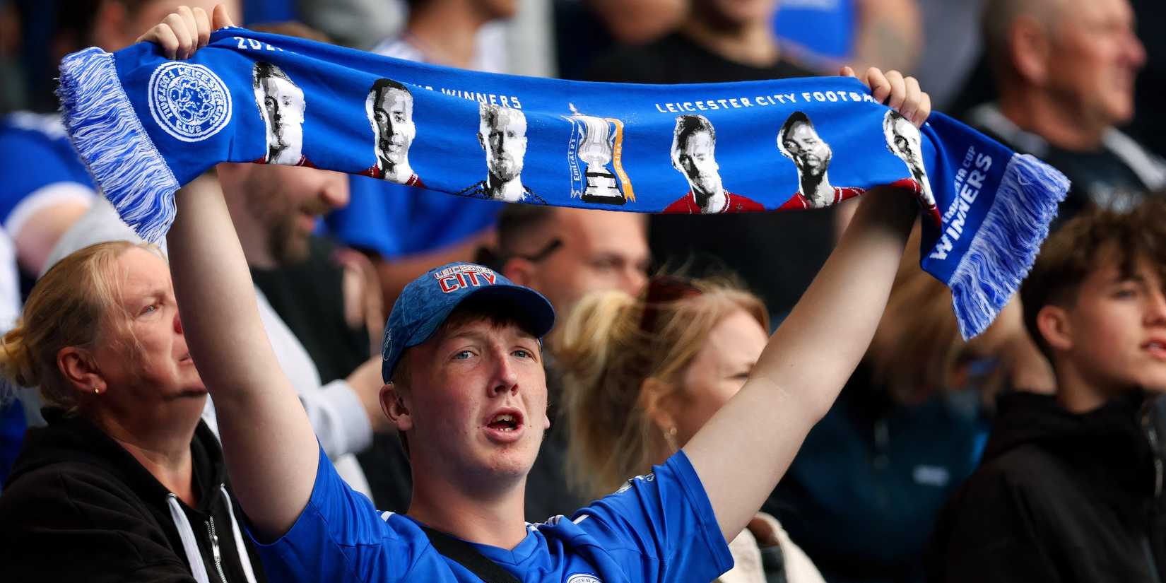 Fan with Leicester City champions scarf