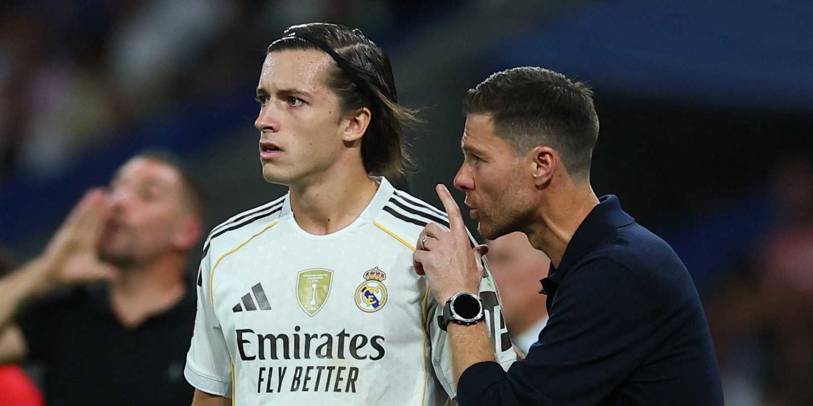 Alvaro Carreras and coach Xabi Alonso talking during Real Madrid vs Mallorca.