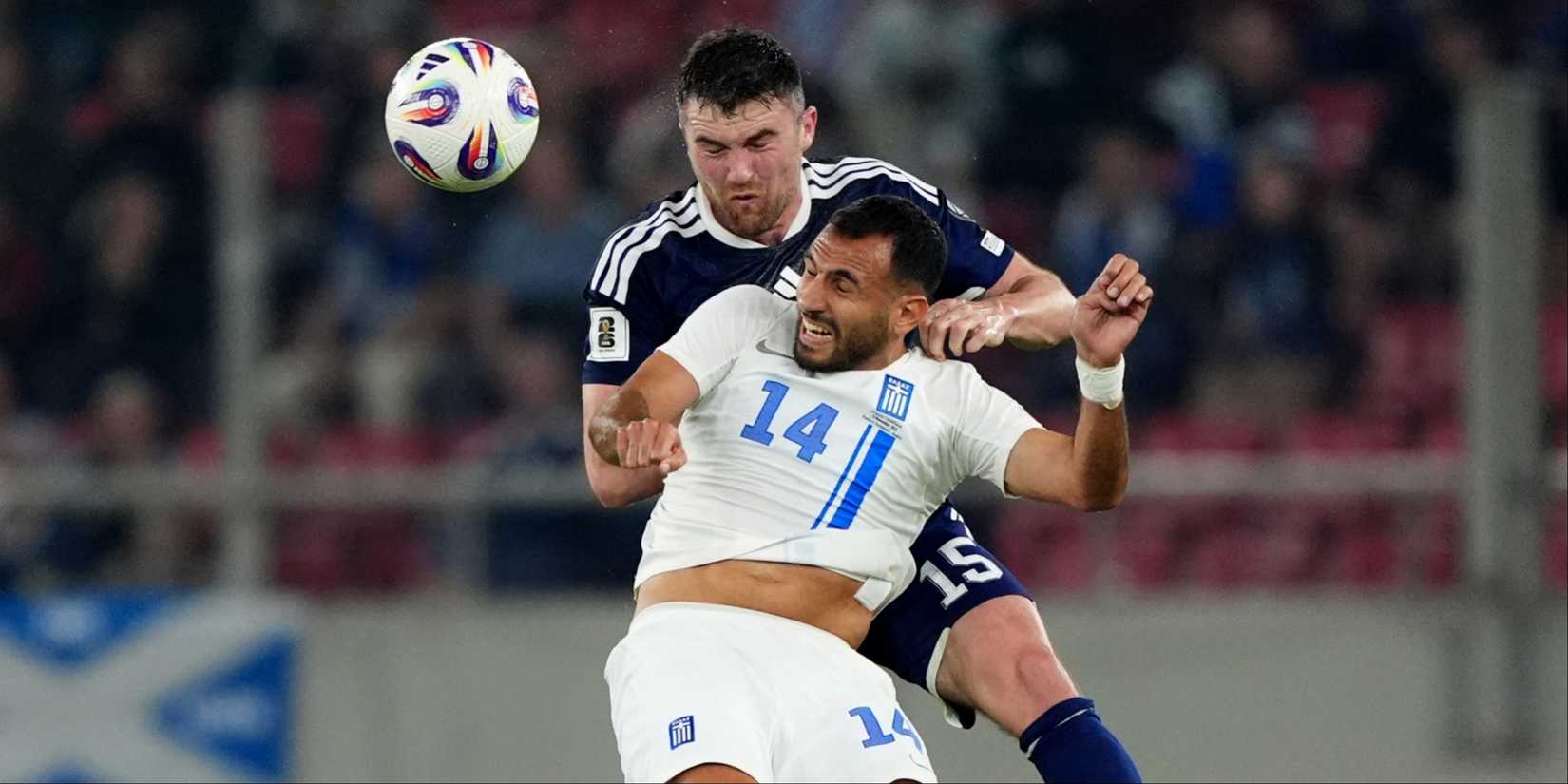 John Souttar of Scotland goes up for a header against Greece