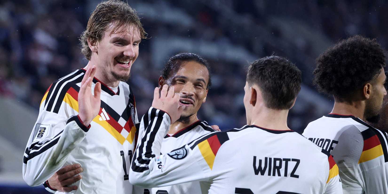 Germany's Nick Woltemade celebrates scoring their second goal with Leroy Sane and Florian Wirtz