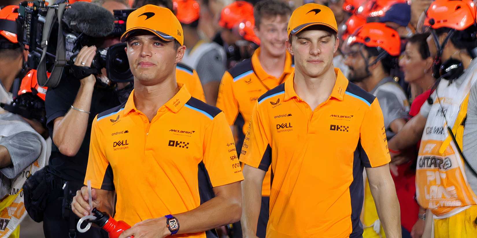Lando Norris and Oscar Piastri looking frustrated
