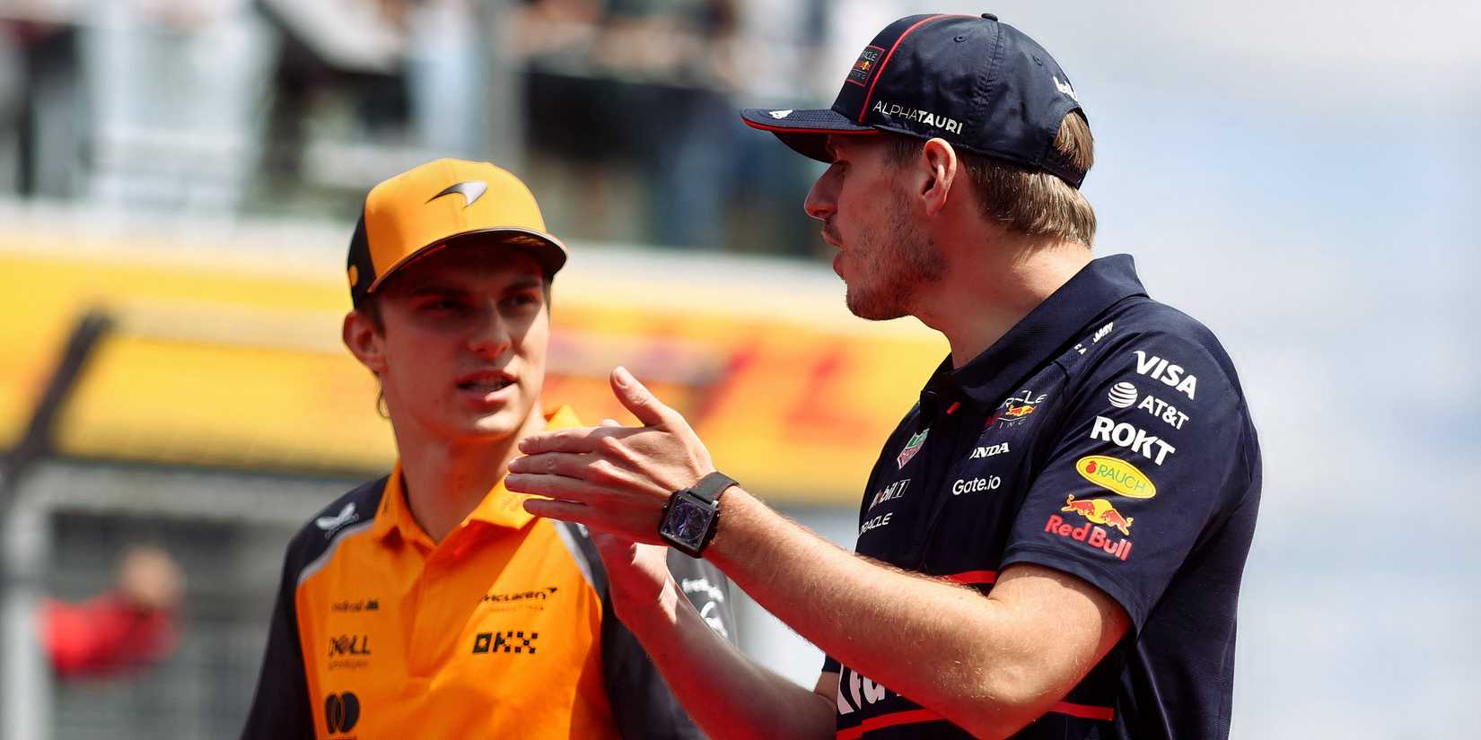 Norris and Verstappen talking on the F1 grid.