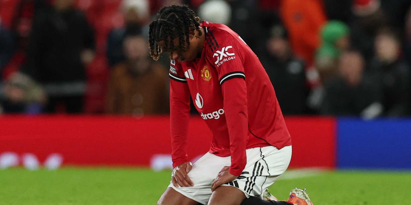 Manchester United's Leny Yoro looks dejected