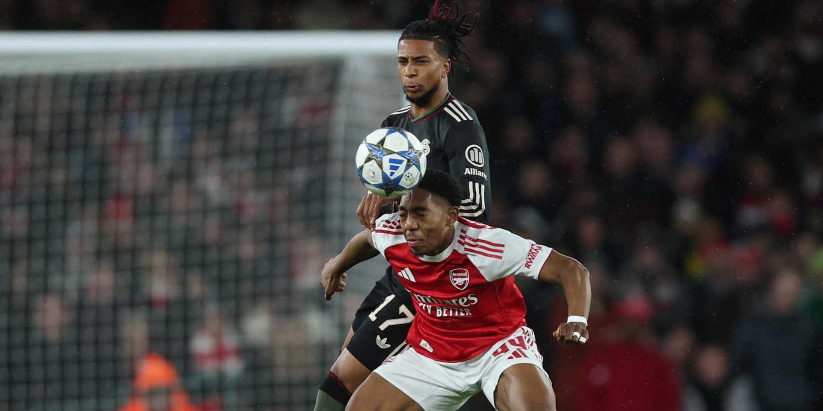 Arsenal's Myles Lewis-Skelly in action with Bayern Munich's Michael Olise