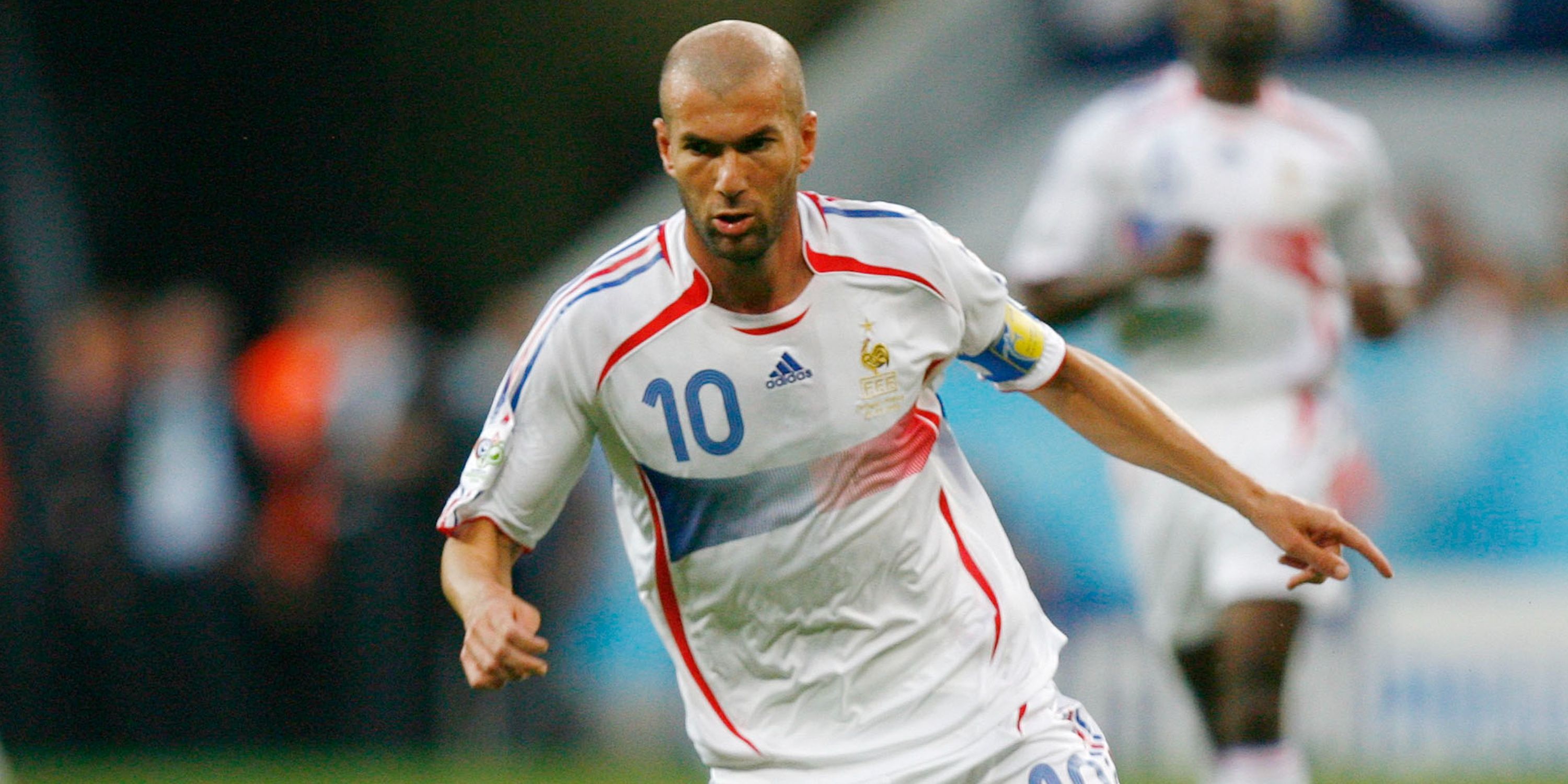 France's Zinedine Zidane runs with the ball against Portugal.