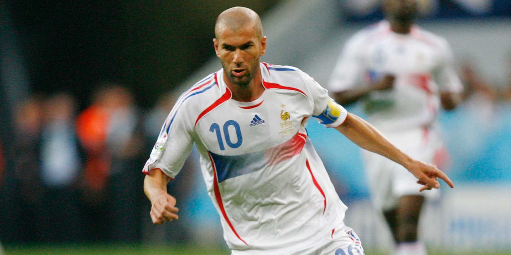 France's Zinedine Zidane runs with the ball against Portugal.