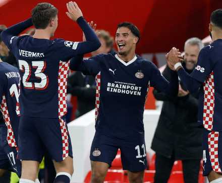 PSV players celebrating after defeating Liverpool in the UEFA Champions League