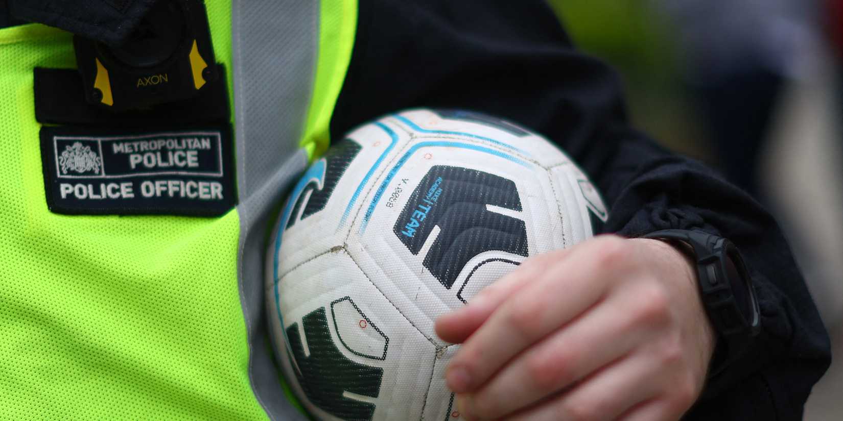 Police officer holding a ball