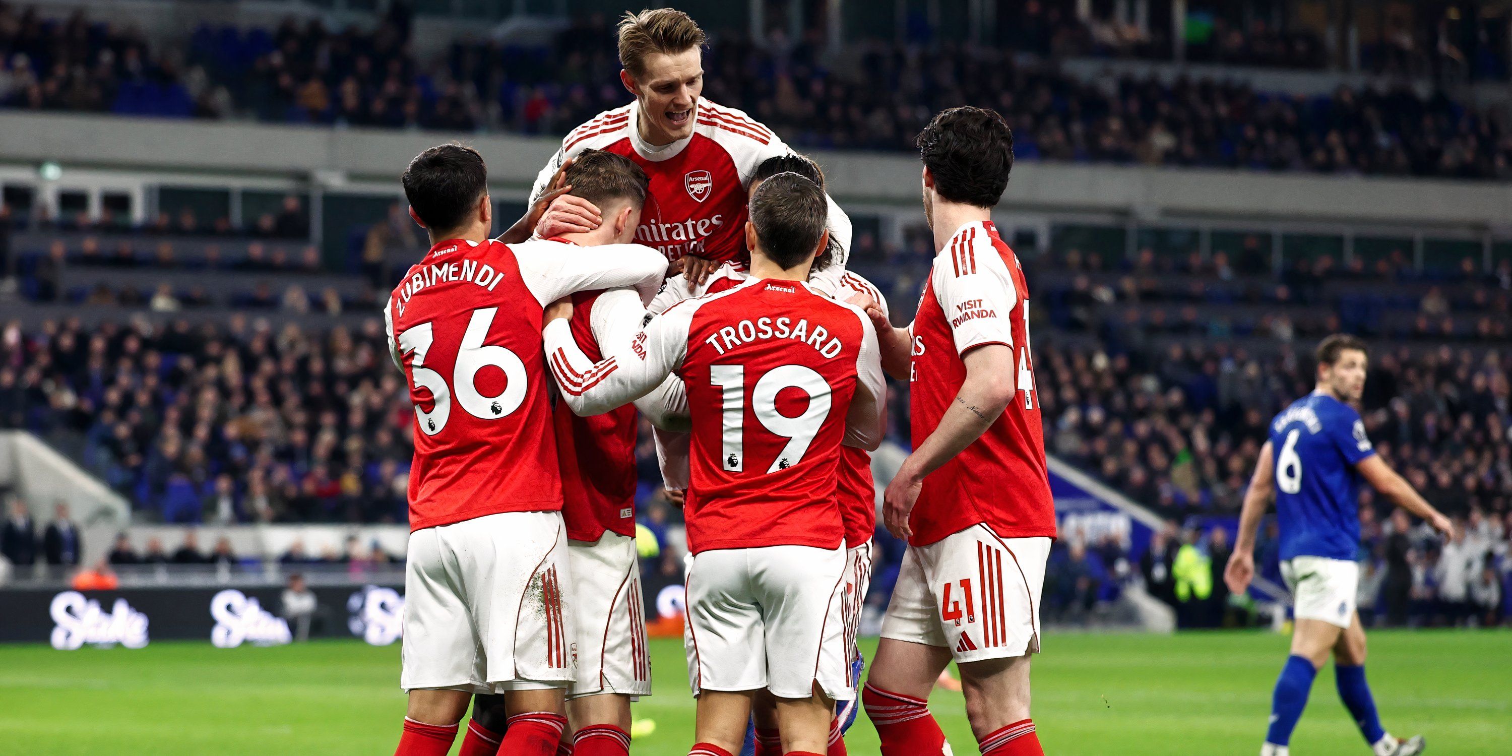 Arsenal players celebrating after scoring against Everton in the Premier League