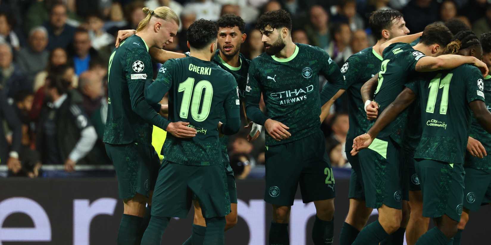 Manchester City players celebrating after scoring against Real Madrid in the UEFA Champions League