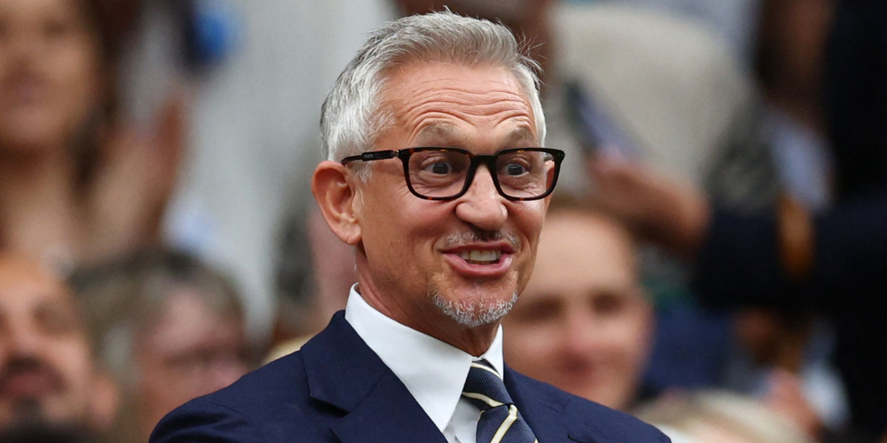 Former footballer and TV presenter Gary Lineker looking happy at Wimbledon in the royal box on centre court