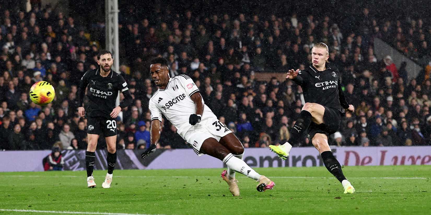 Manchester City's Erling Haaland scores against Fulham.