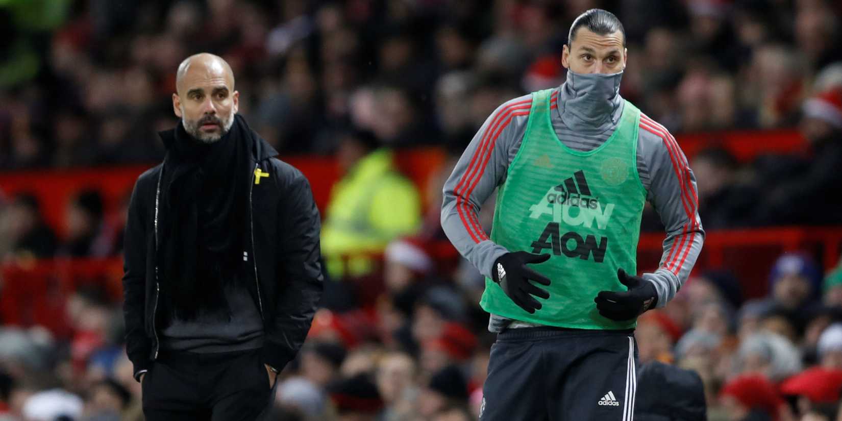 Manchester City manager Pep Guardiola looks on at Manchester United's Zlatan Ibrahimovic