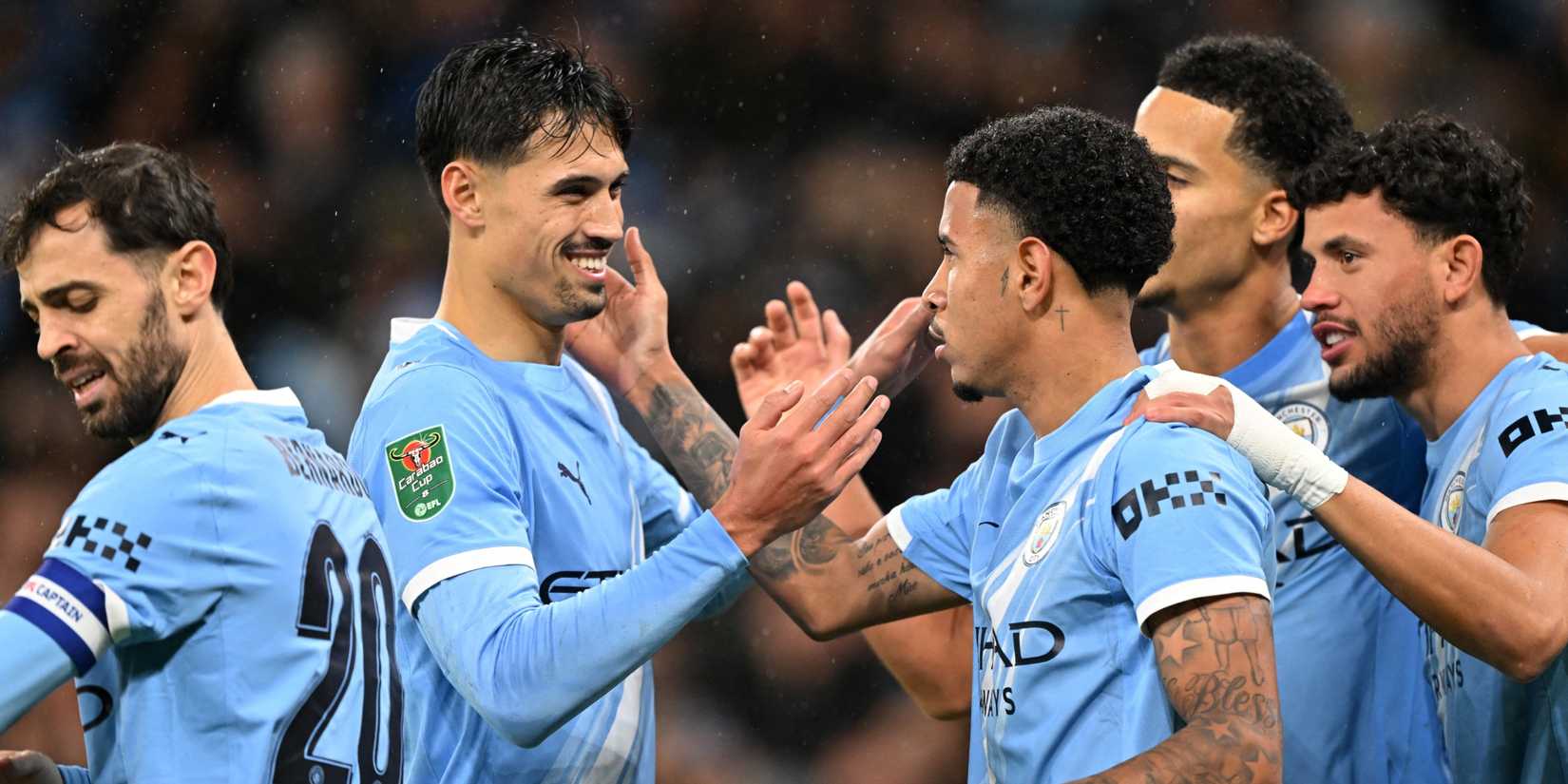 Manchester City's Savinho celebrates with teammates