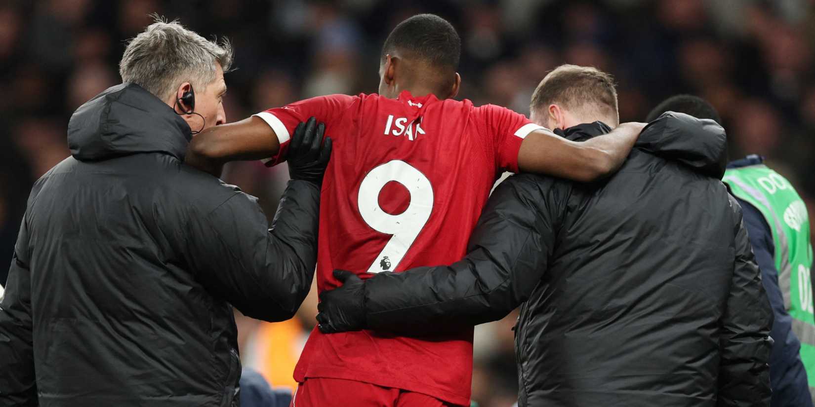 Liverpool's Alexander Isak is helped off the pitch after sustaining an injury