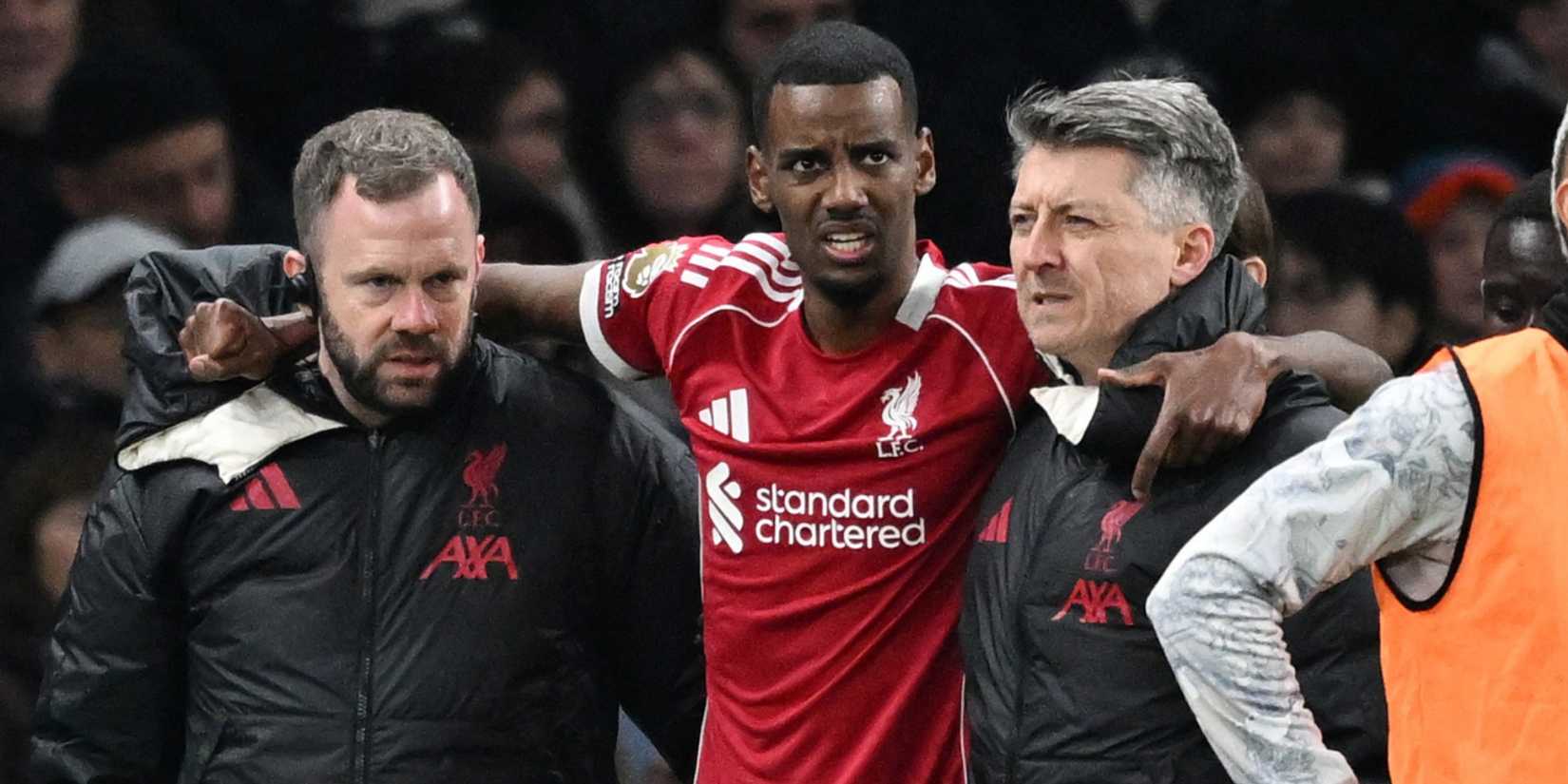 Liverpool's Alexander Isak is helped off the pitch after sustaining an injury and is substituted vs Tottenham Hotspur