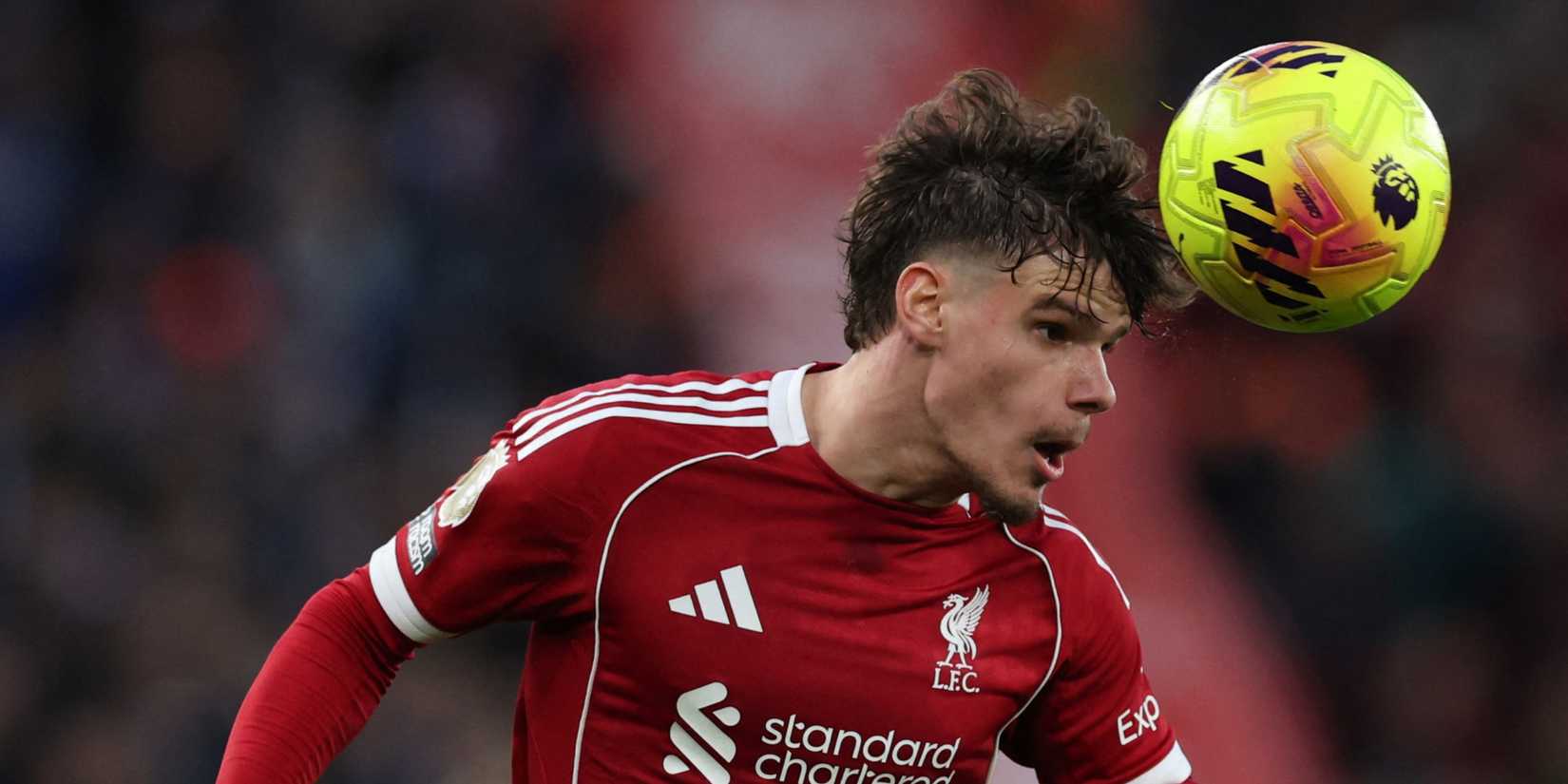 Liverpool's Milos Kerkez heads the ball