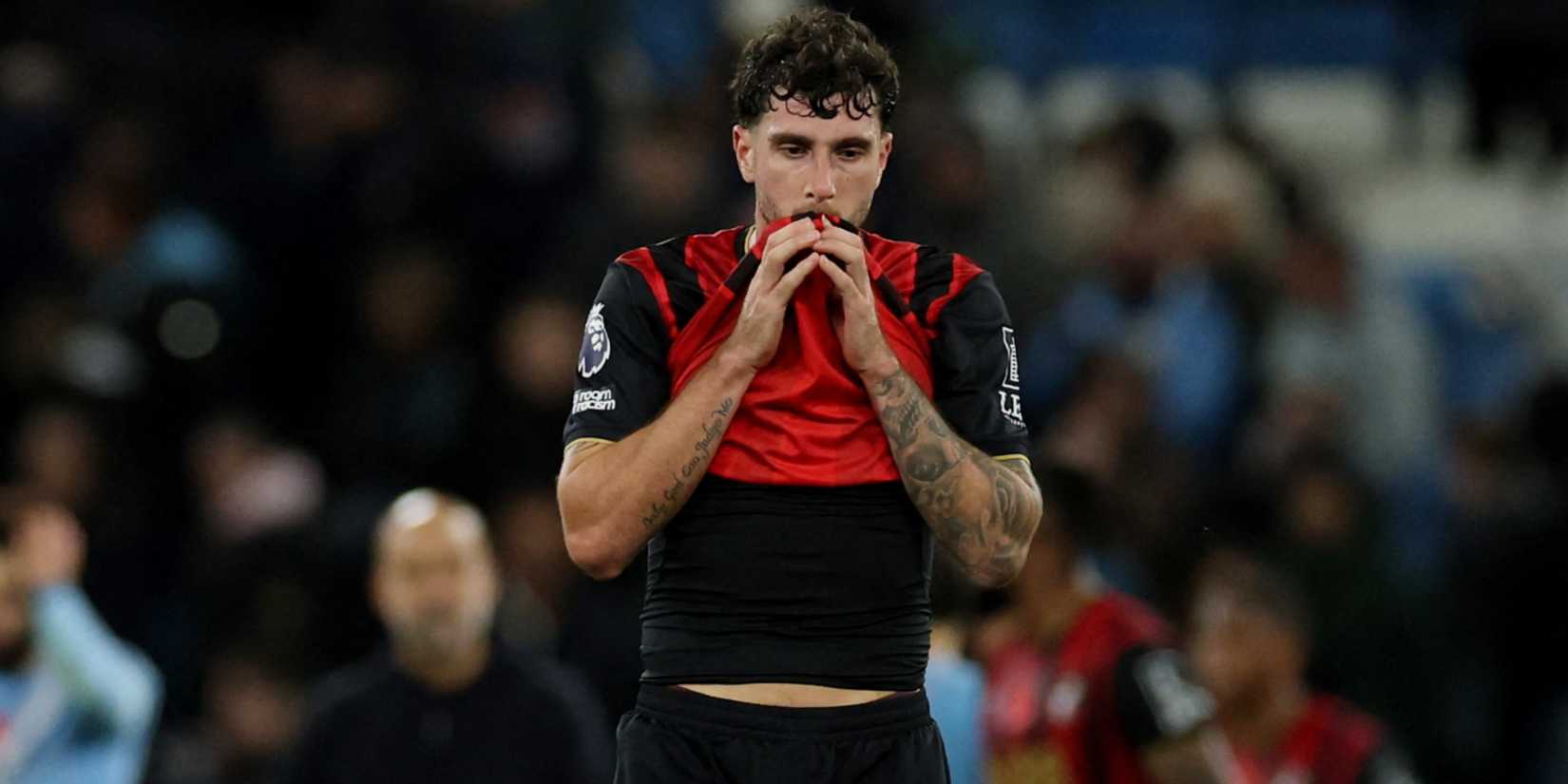 AFC Bournemouth's Marcos Senesi puts his shirt to his mouth