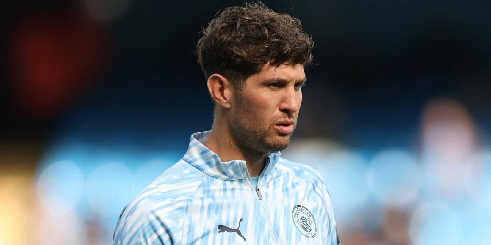 Manchester City's John Stones warms up