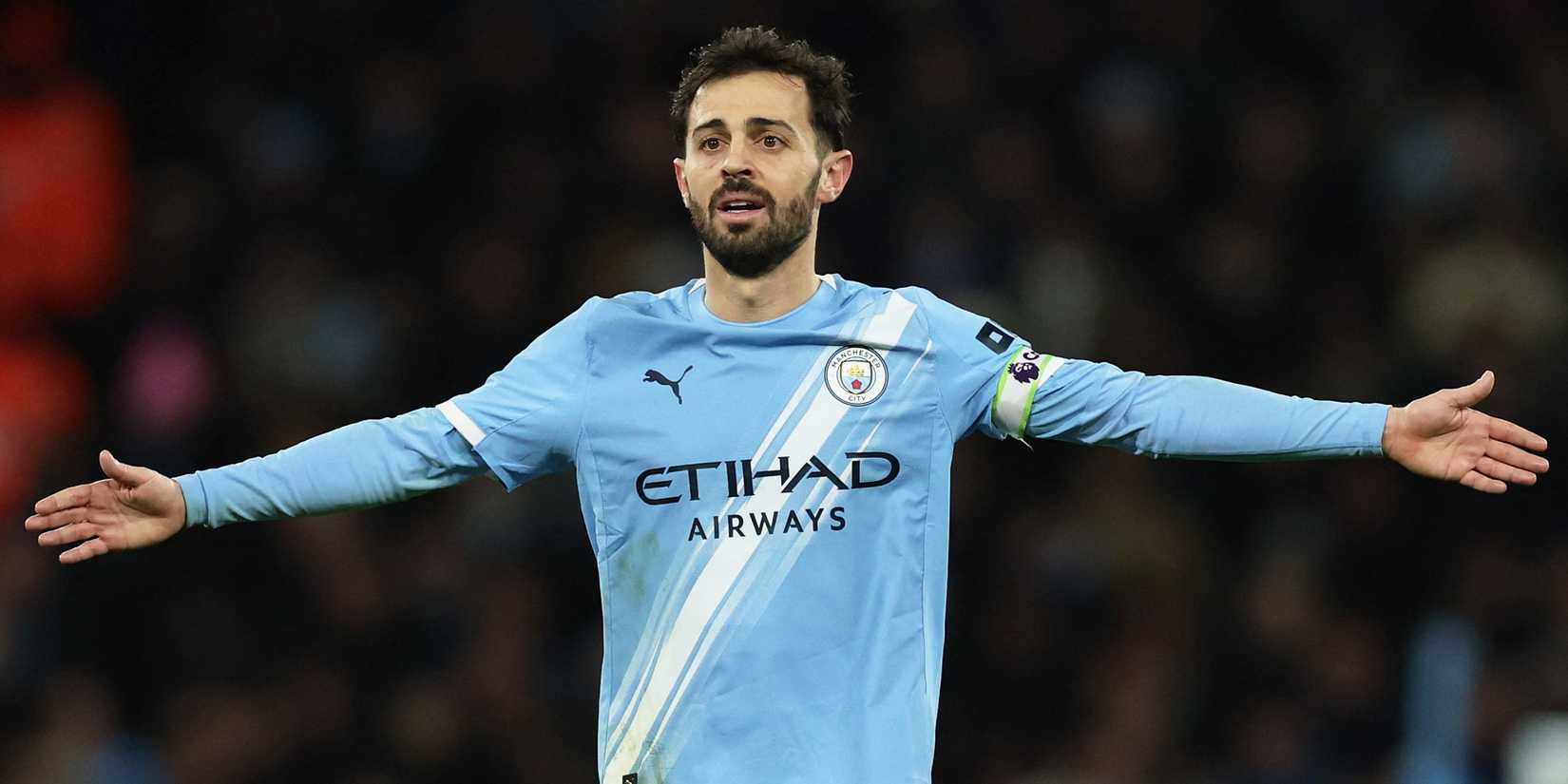 Manchester City's Bernardo Silva holds his hands up