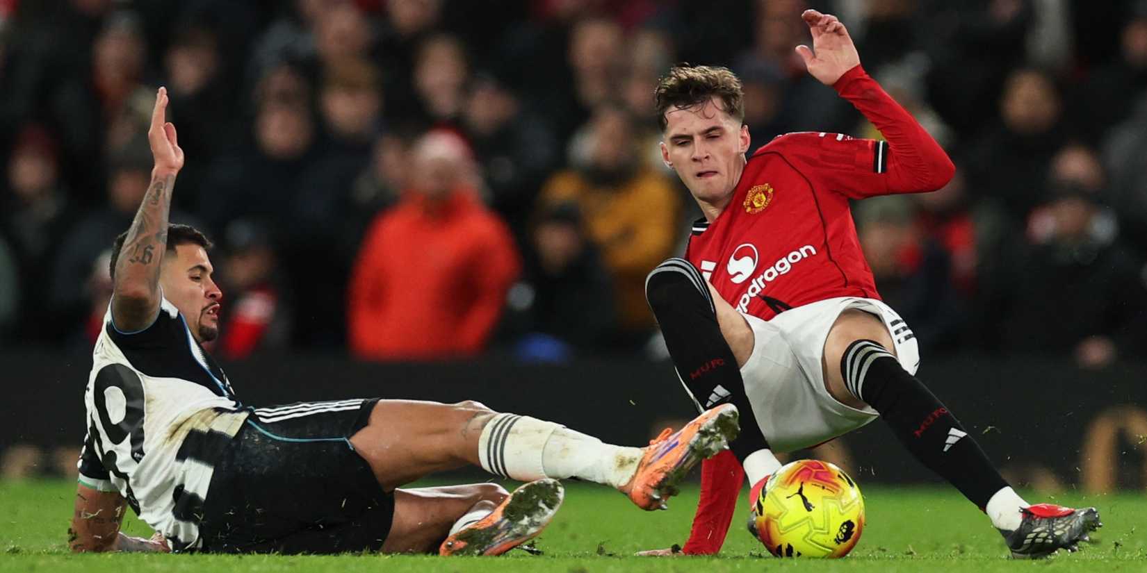 Manchester United's Jack Fletcher challenges Newcastle's Bruno Guimaraes for the ball.