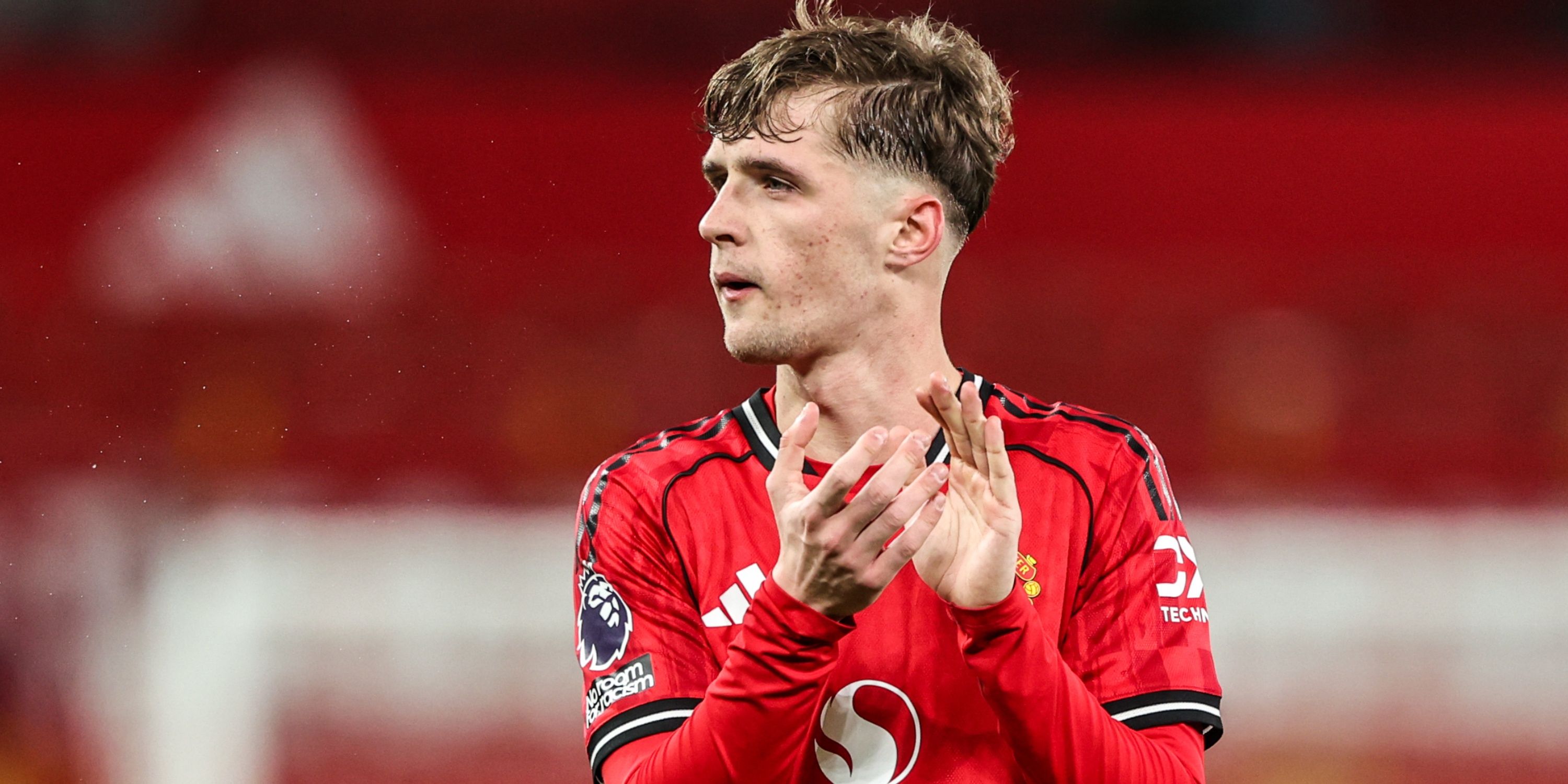 Jack Fletcher of Manchester United applauds fans