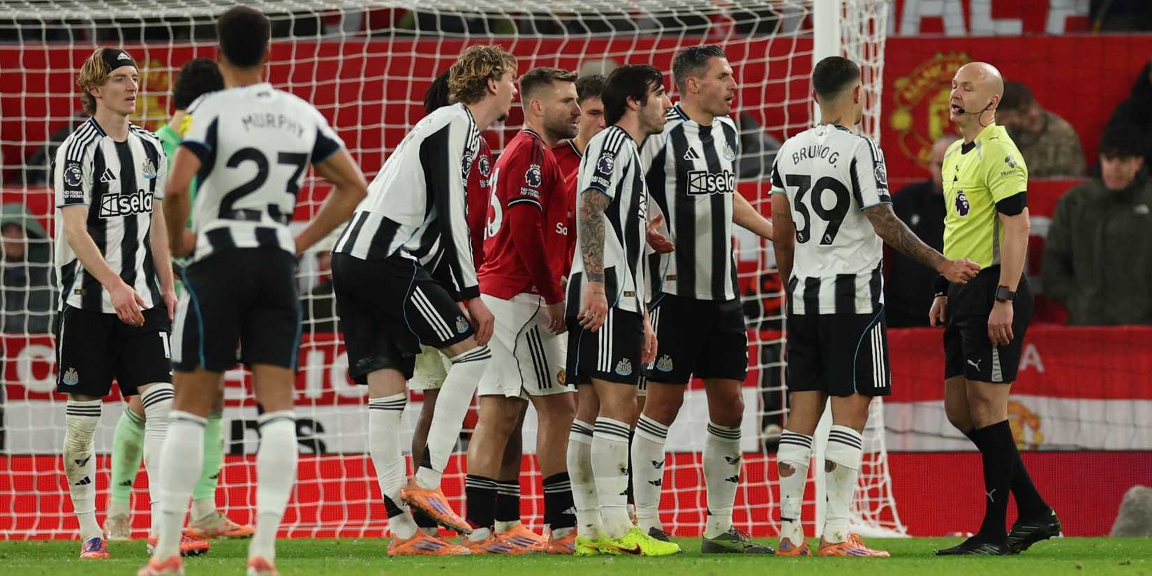 Newcastle United's Bruno Guimaraes, Sandro Tonali and Fabian Schar remonstrate to referee Anthony Taylor