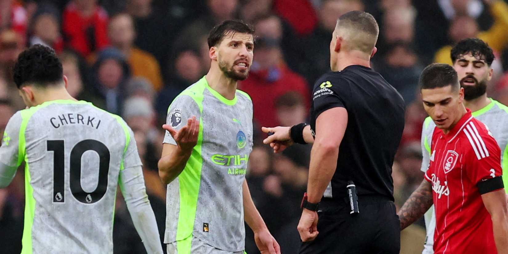 Manchester City's Ruben Dias remonstrates with referee Robert Jones