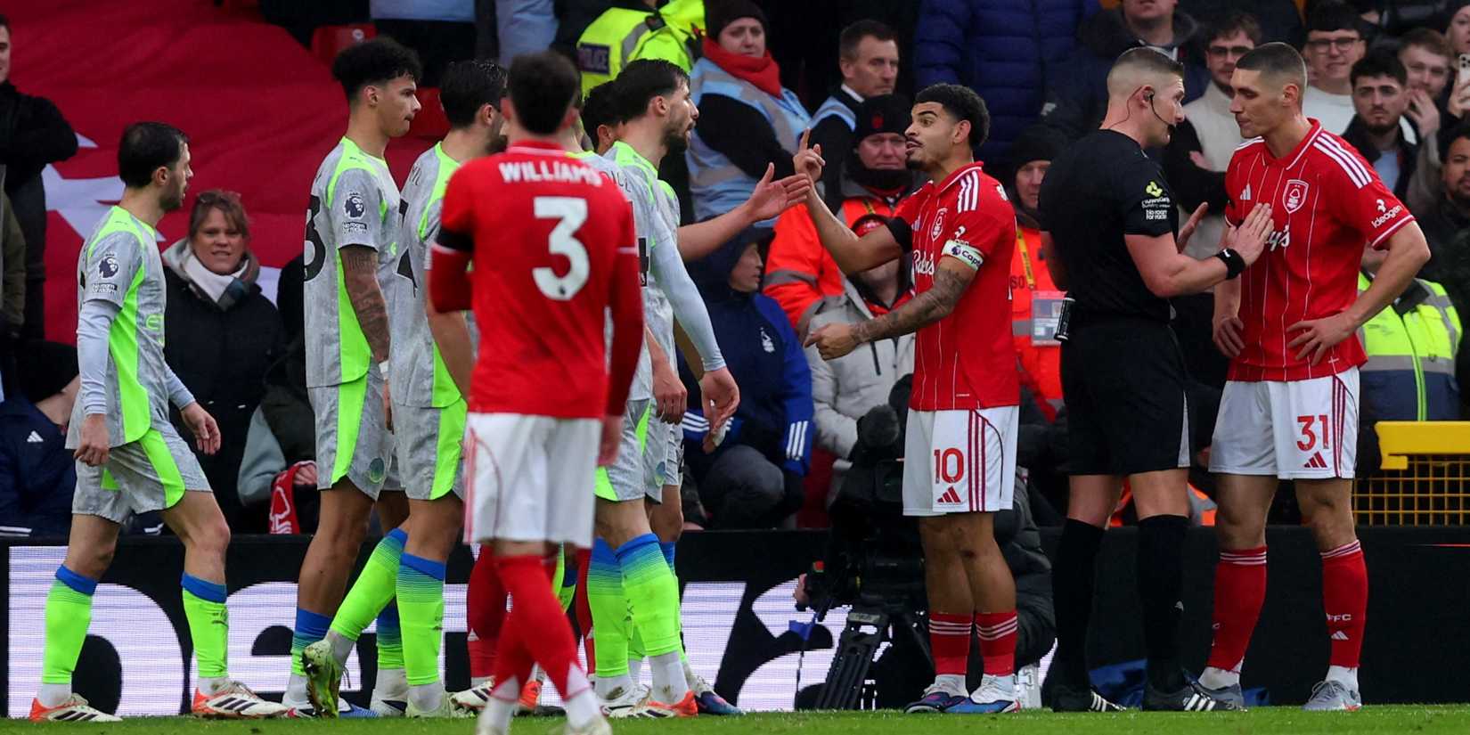 Manchester City's Ruben Dias clashes with Nottingham Forest's Morgan Gibbs-White as Nottingham Forest's Nikola Milenkovic remonstrates with referee Robert Jones