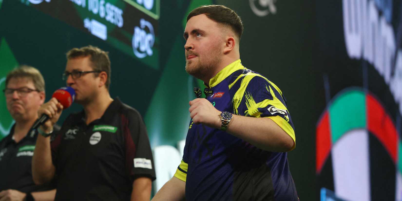 Luke Littler celebrates after winning his semifinal match against Ryan Searle