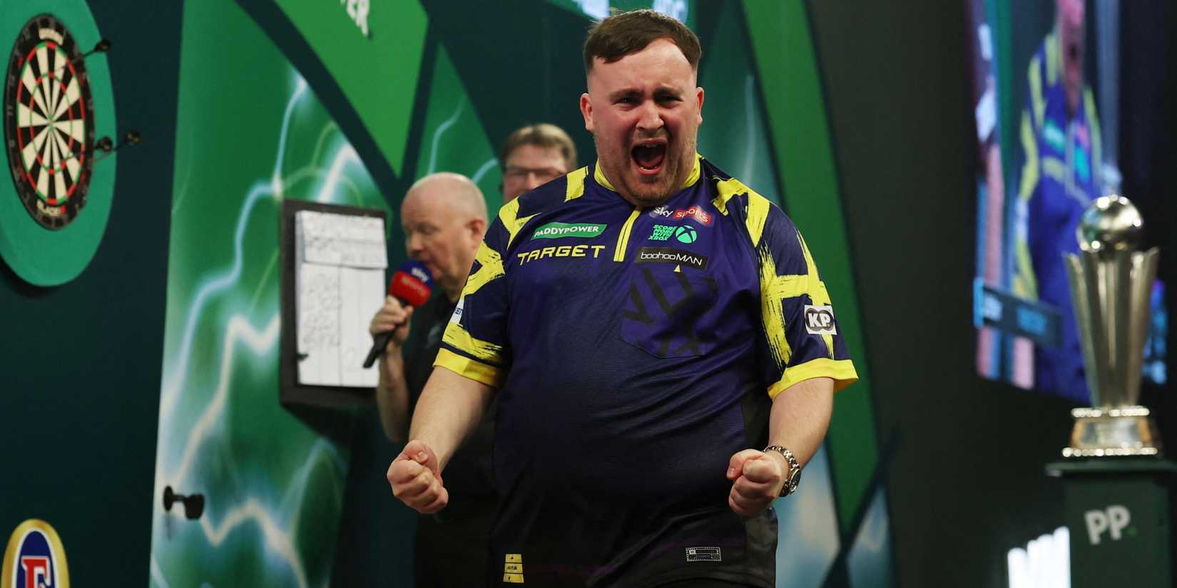 Luke Littler celebrates winning the World Darts Championship