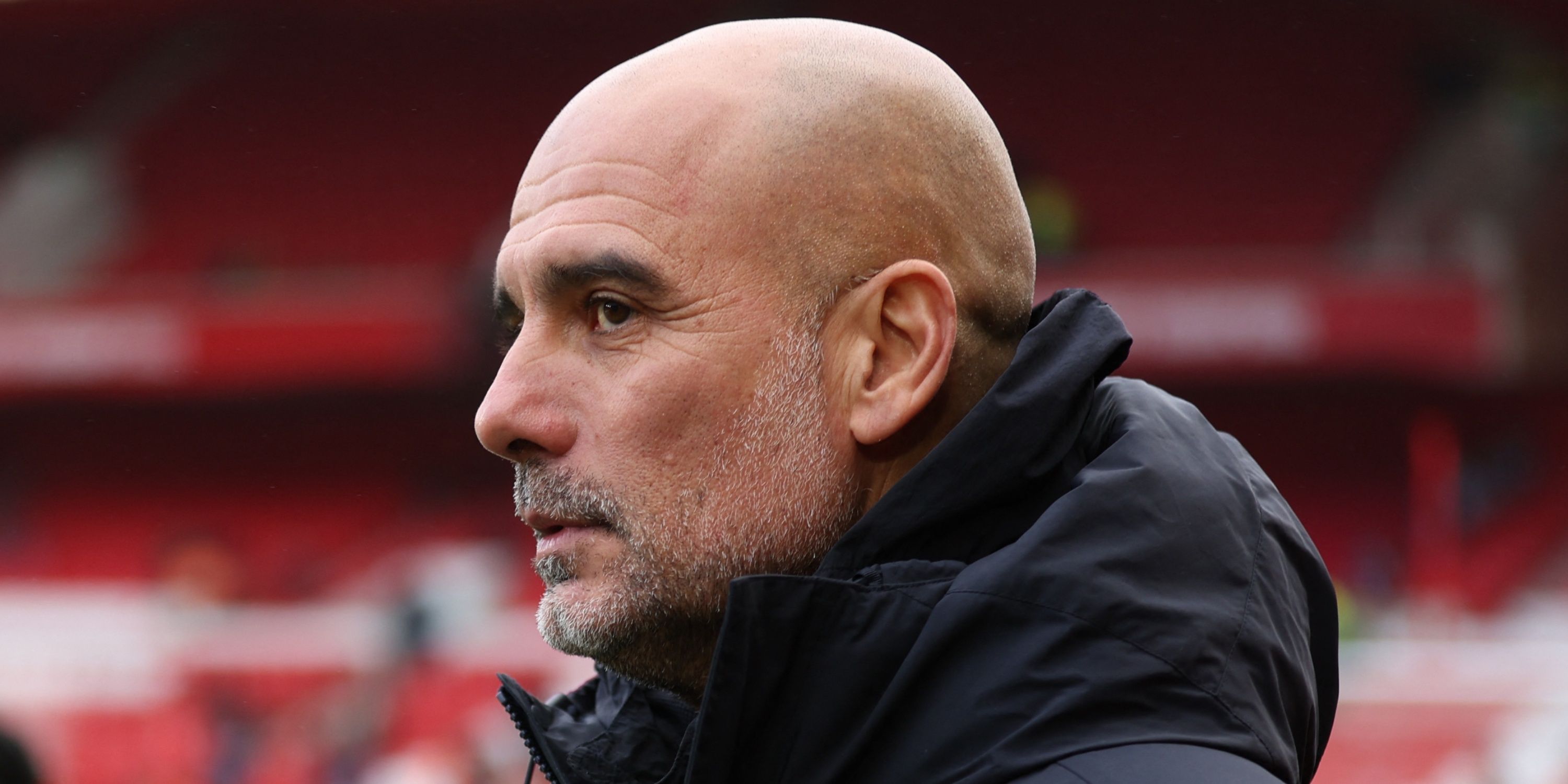 Manchester City manager Pep Guardiola looks on