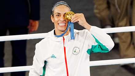 Imane Khelif celebrates with Olympic gold medal