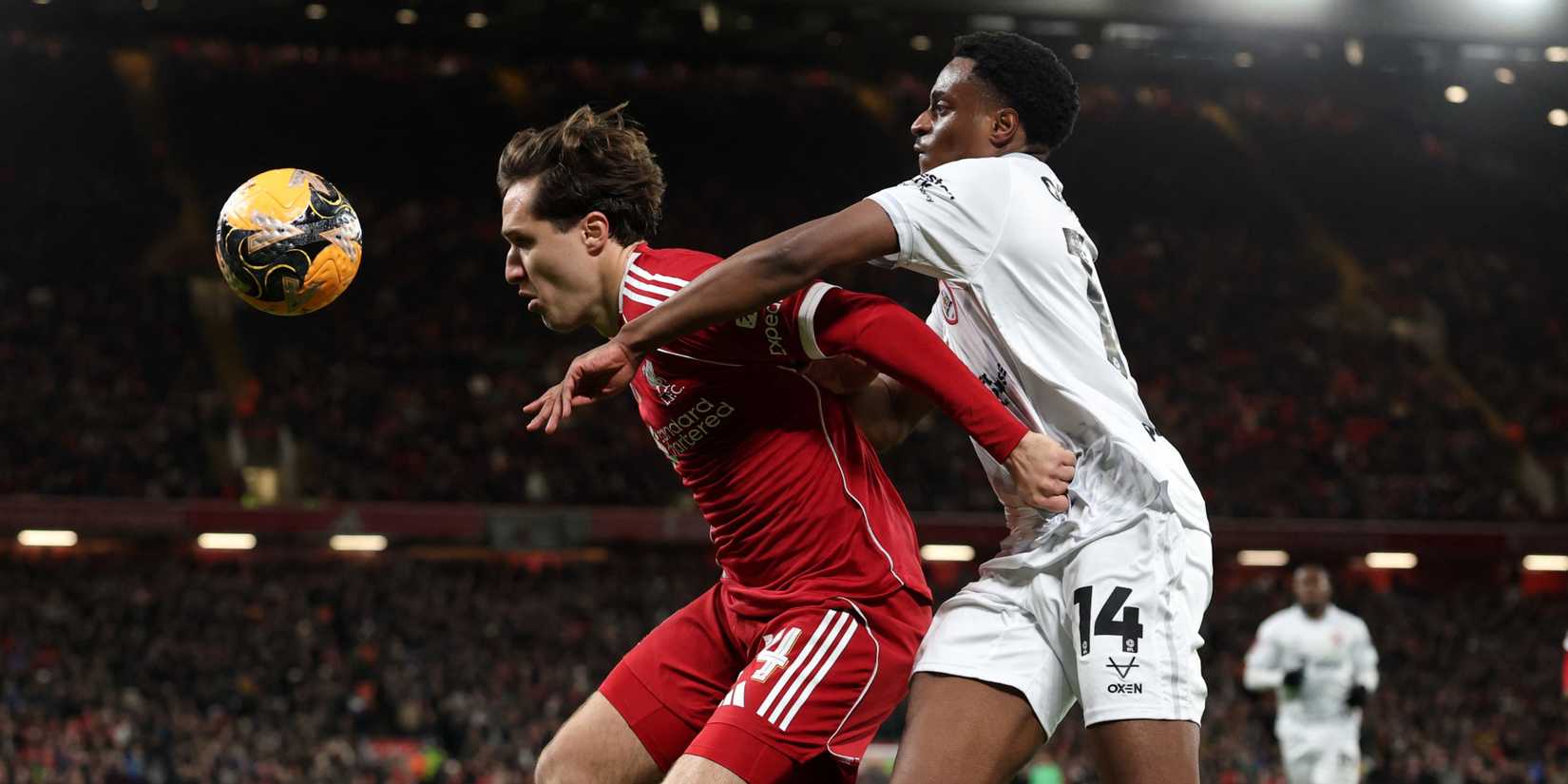 Liverpool's Federico Chiesa in action with Barnsley's Nathanael Ogbeta