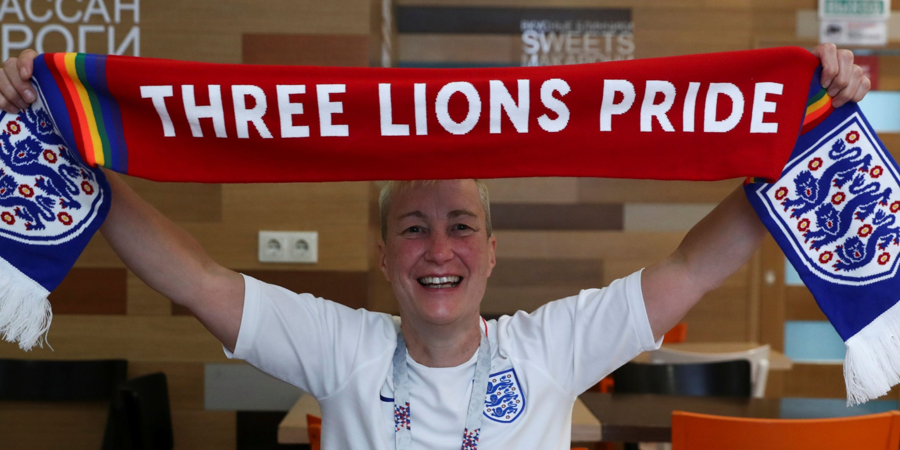 England's fan and LGBT rights campaigner Di Cunningham displays a scarf during an interview with Reuters in Volgograd, Russia, June 18 2018