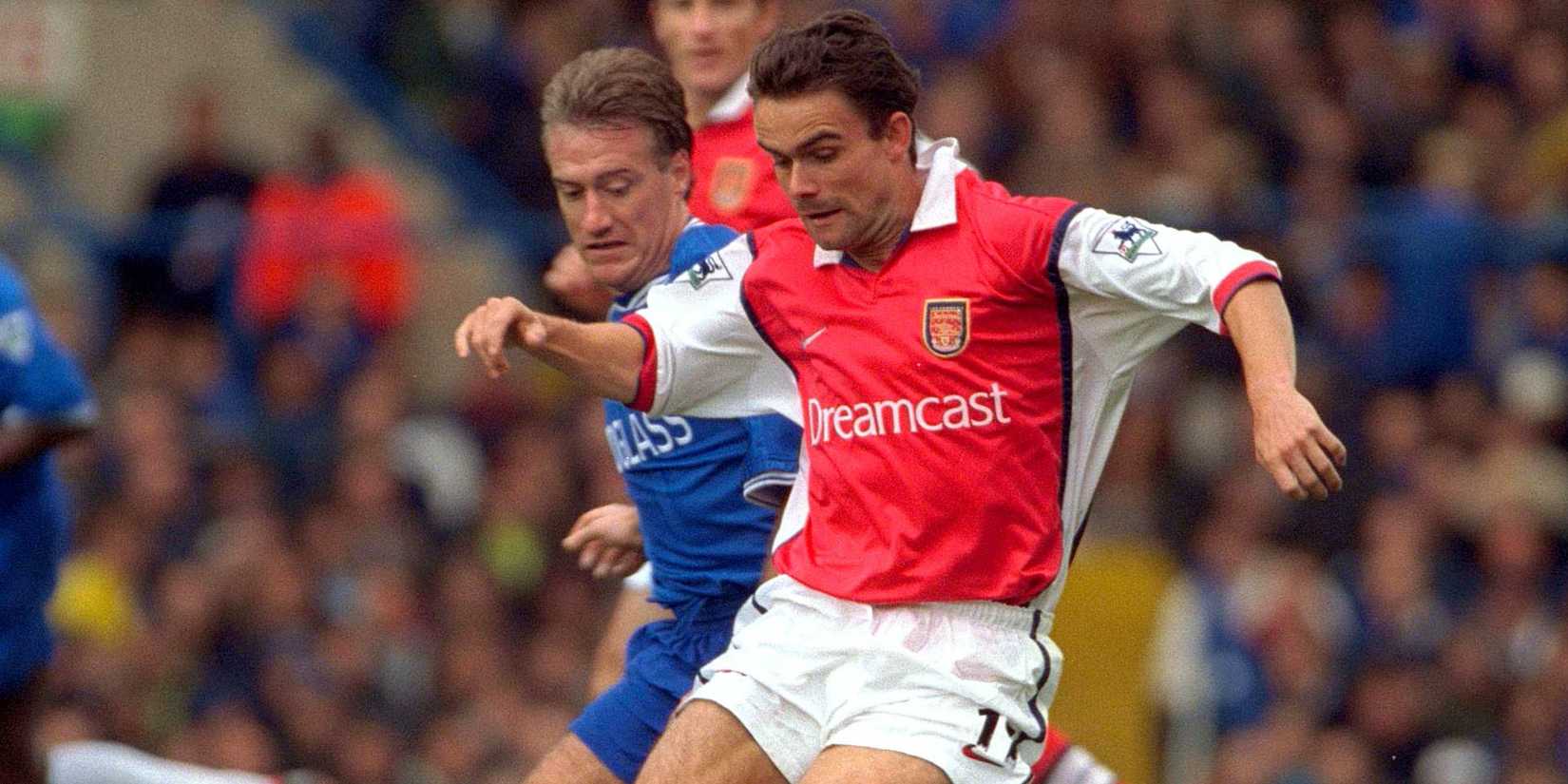 Arsenal's Marc Overmars is challenged by Didier Deschamps