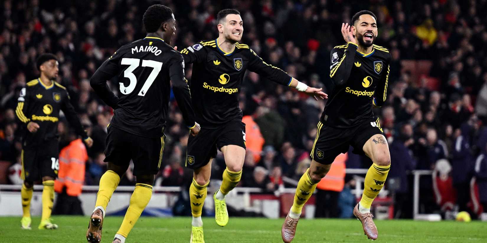 Manchester United's Matheus Cunha celebrates scoring their third goal with Diogo Dalot and Kobbie Mainoo