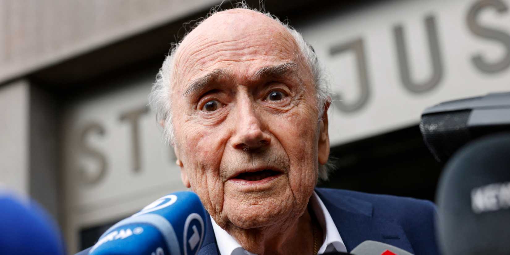 Former FIFA President Sepp Blatter speaks with members of the media as he leaves the tribunal after getting acquitted off corruption charges against him in Muttenz, Switzerland