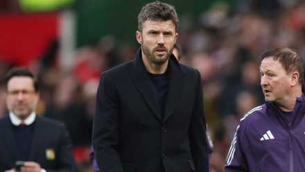 Manchester United caretaker manager Michael Carrick walks to his seat