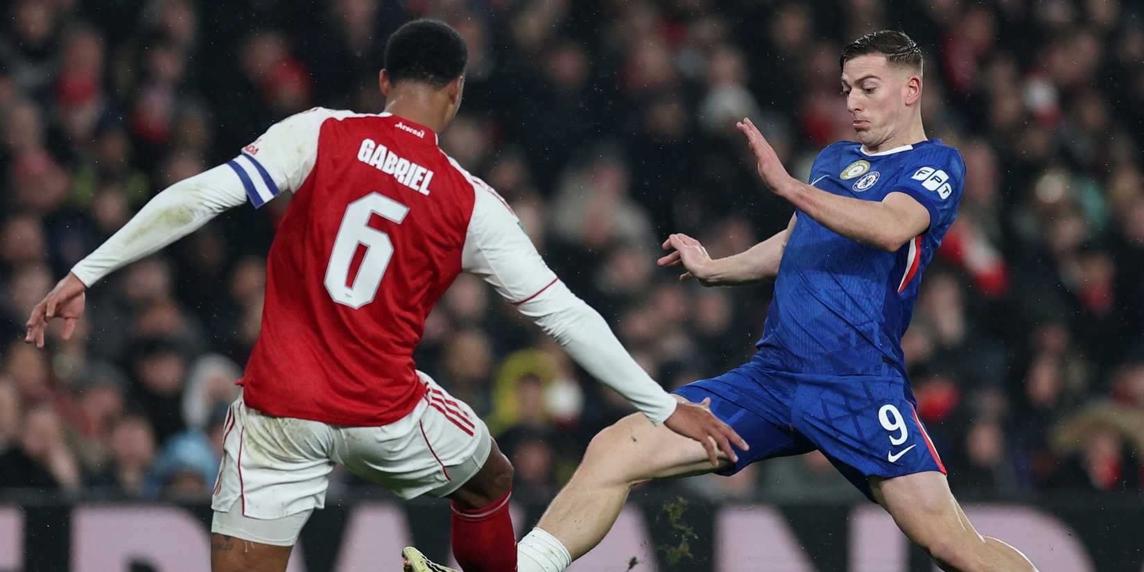 Chelsea's Liam Delap in action with Arsenal's Gabriel Magalhaes