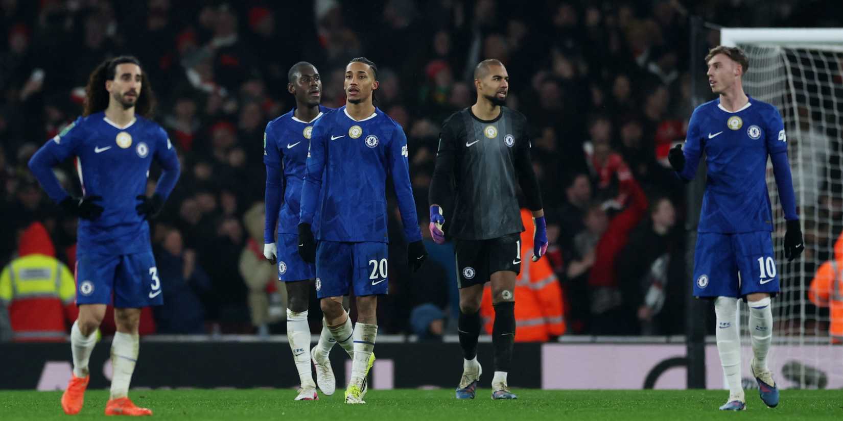Chelsea players look dejected after Arsenal's Kai Havertz scores their first goal