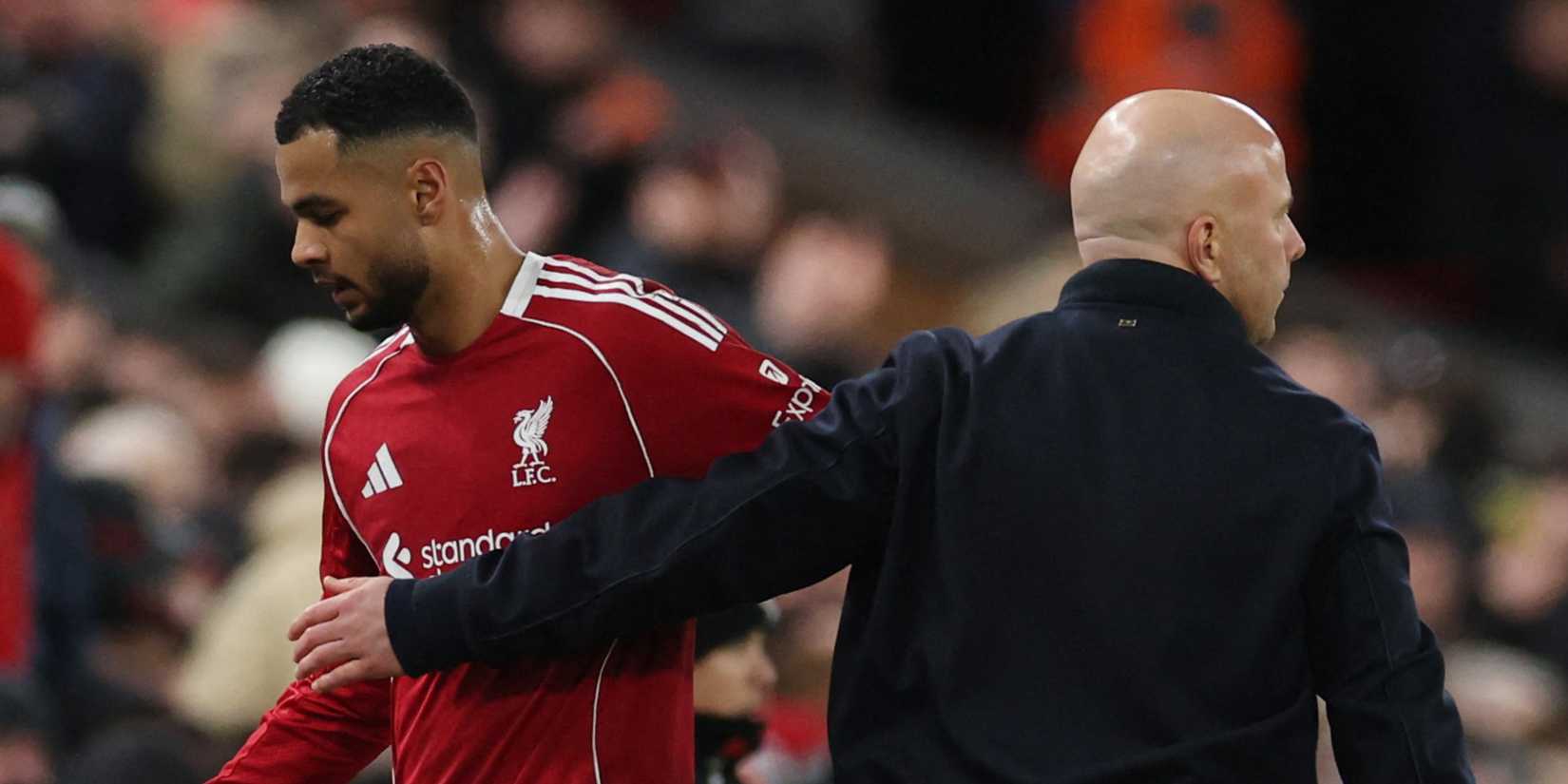 Liverpool's Cody Gakpo walks past manager Arne Slot after he is substituted