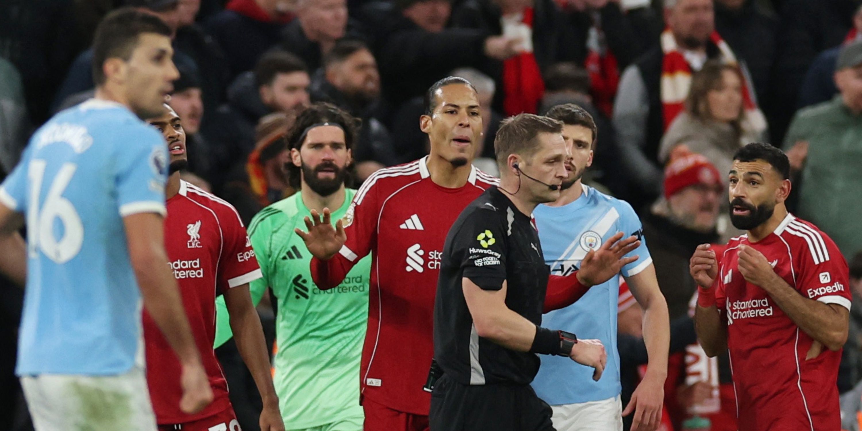 Liverpool's Virgil van Dijk and Mohamed Salah react to referee Craig Pawson