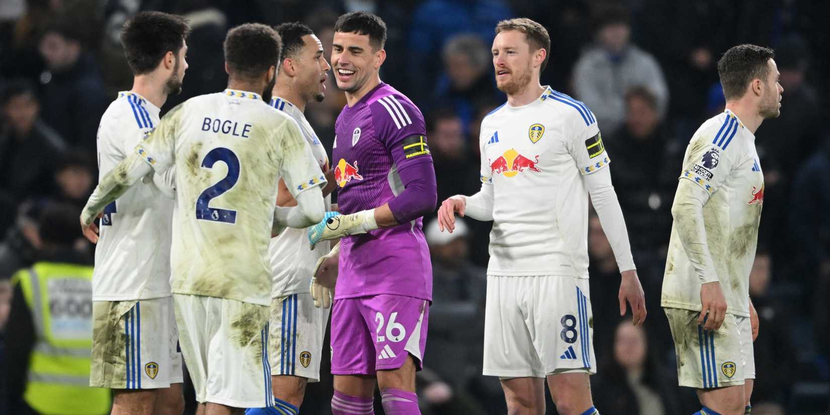 Leeds United's Karl Darlow celebrates with Jayden Bogle and Sean Longstaff after the match